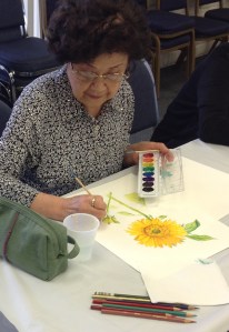 Treasurers' student working on a beautiful watercolor. Photo courtesy of Bowers Museum/Council on Aging Orange County © 2014.