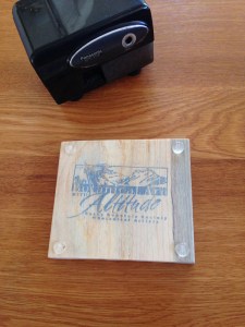 [Brush holder back] Susan Fisher explained that the wood came from pine trees harvested after being killed by Mountain Pine Beetles (Dendroctonus ponderosae), native to the forests of western North America. The blue color of the wood is the result of staining from the beetle infestation. Libby Kyer designed the logo on the back, which was also on the water bottles donated by Libby and her husband. Photo by Deb Shaw.