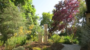 Standing stones in the completed front garden are reclaimed Kansas fence posts, pieces of ancient ocean limestone bed, used to mark farm boundaries in a prairie ecosystem lacking trees.Photo © 2016, Cordelia Donnelly.