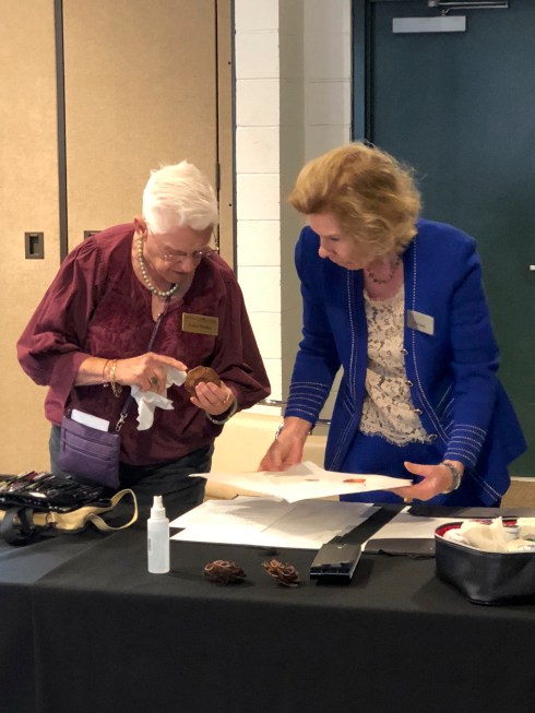 Patricia Mark setting up for the botanical art demonstration, with Leslie Walker.