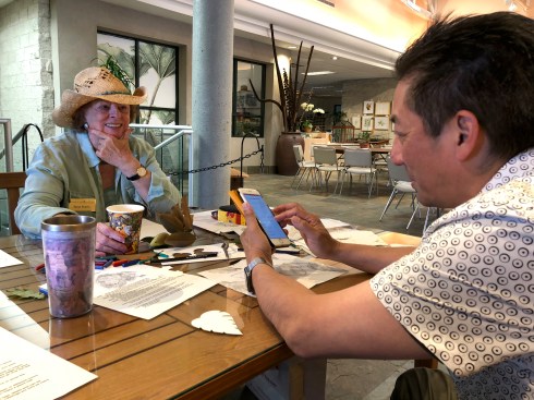 The calm before the crowds: (L) BAGSC member Tania Norris and Robert Hori ready the tables for the drop-in family botanical art activities.